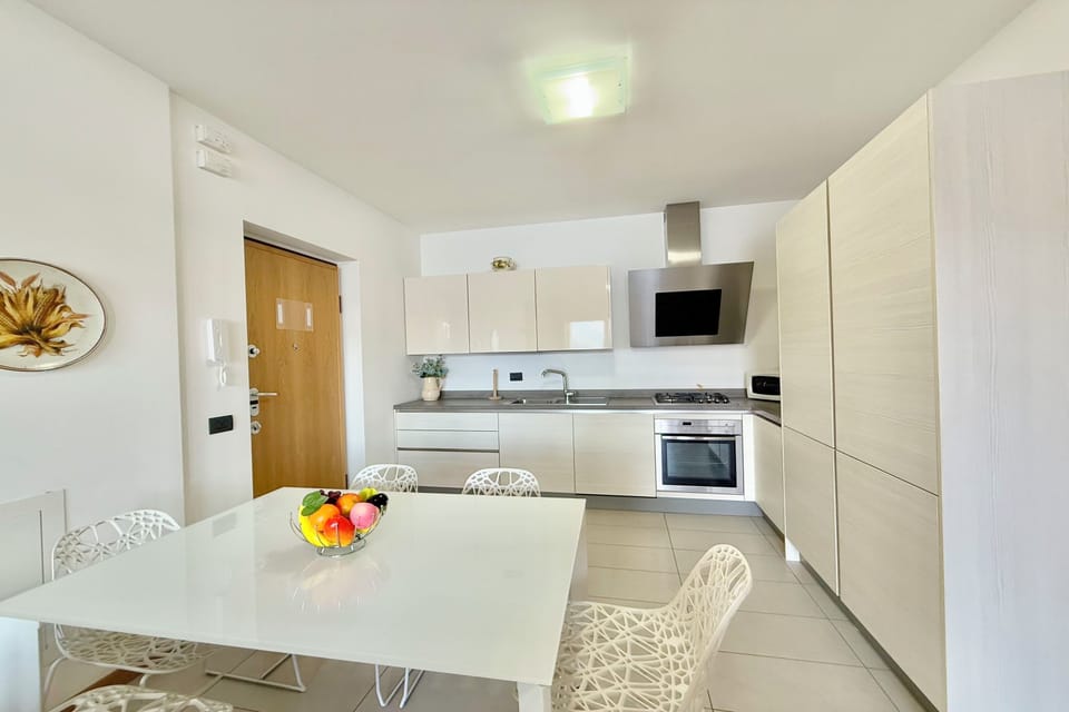 Family Apartment, 2 Bedrooms, Balcony, Mountainside (Residence degli Oleandri 6A) | Private kitchen | Coffee/tea maker, microwave, oven, stovetop