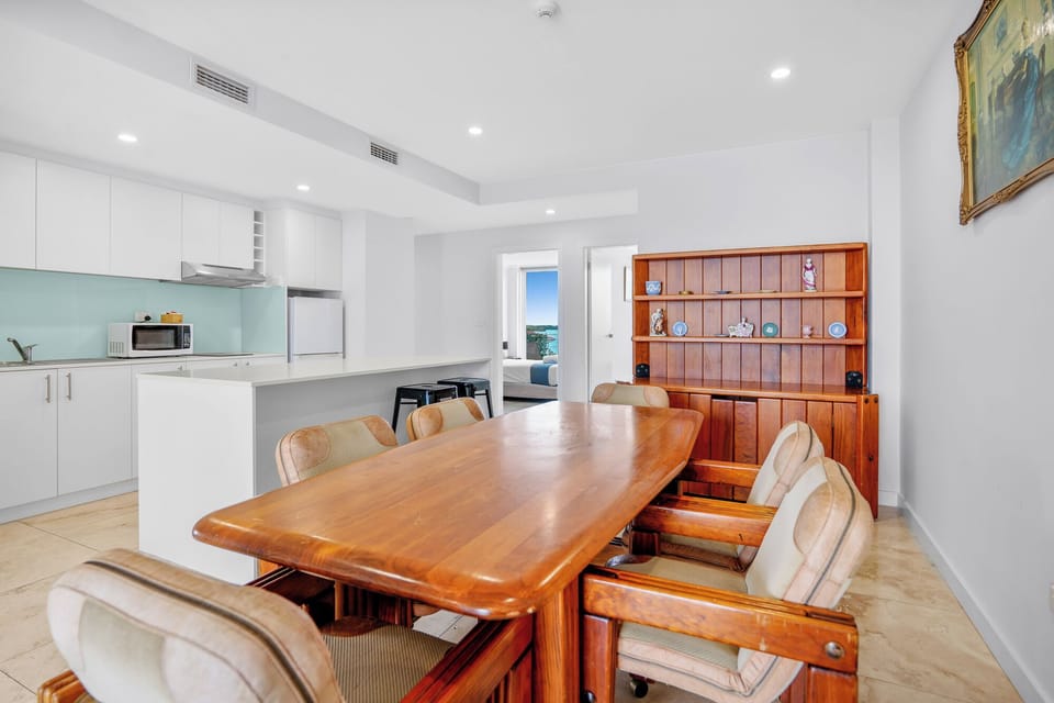 Family Apartment, 4 Queen Bedrooms | Living area | Flat-screen TV