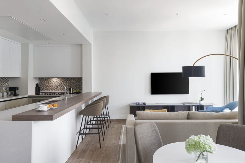 Deluxe Suite, 2 Bedrooms, Balcony | Living area | 55-inch LED TV with satellite channels, TV