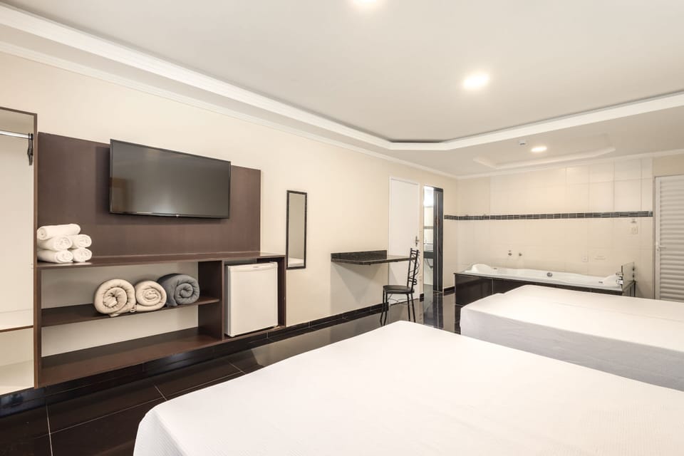 Superior Quadruple Room, Jetted Tub | Television