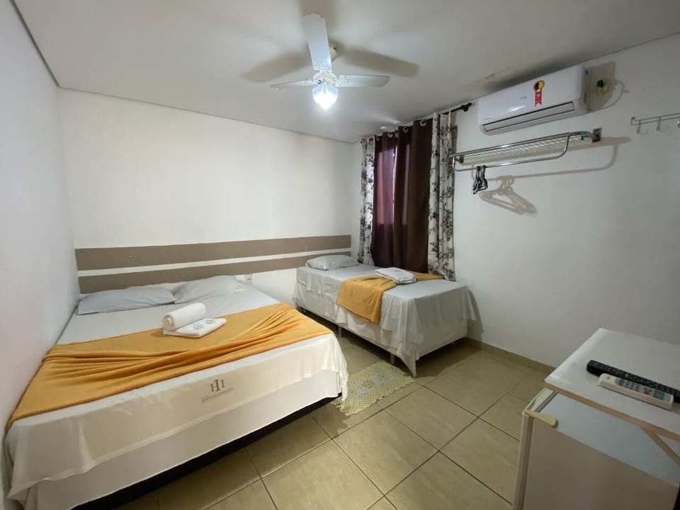 Family Triple Room | Minibar, desk, WiFi (free), bed sheets