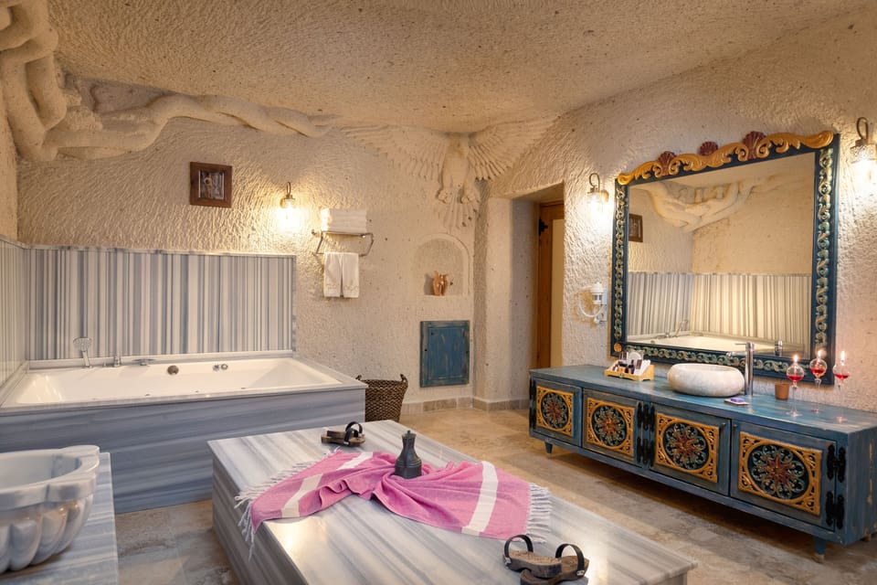 Deluxe King Suit | Bathroom | Designer toiletries, hair dryer, slippers, heated floors