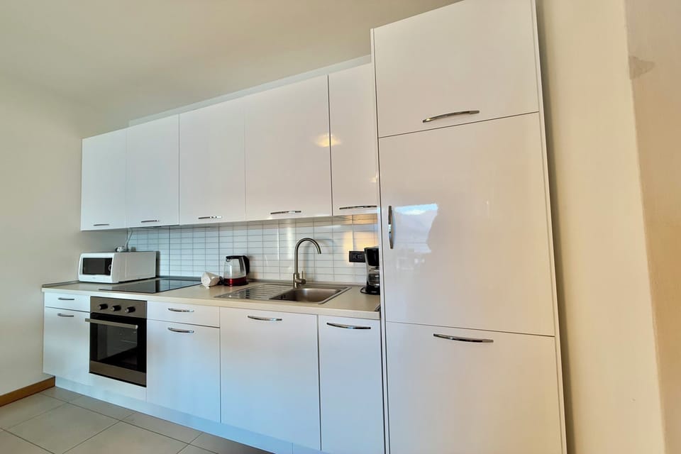 Family Apartment, Multiple Bedrooms, Mountainside (Residence degli Oleandri 4B) | Private kitchen | Full-size fridge, microwave, oven, stovetop