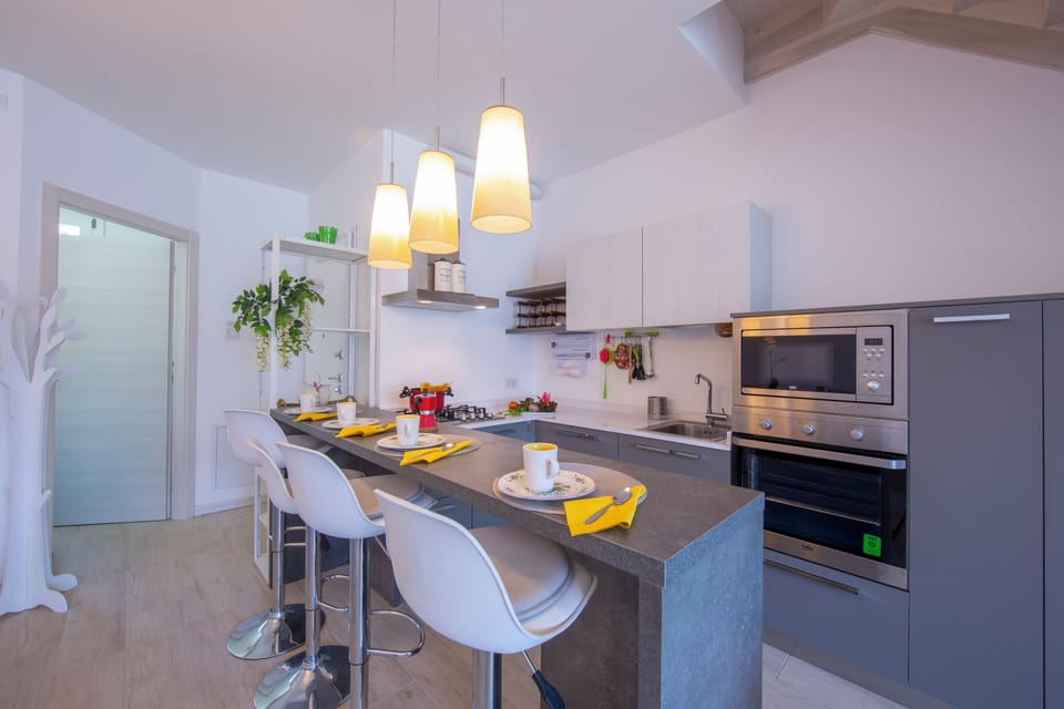 Family Apartment, Multiple Bedrooms, 2 Bathrooms, Mountainside (Como Lake Modern Apartment Ulivi) | Private kitchen | Full-size fridge, microwave, oven, stovetop