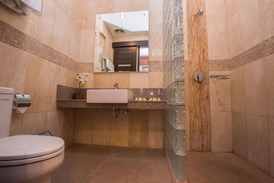 Suite, 2 Double Beds | Bathroom | Shower, towels, soap