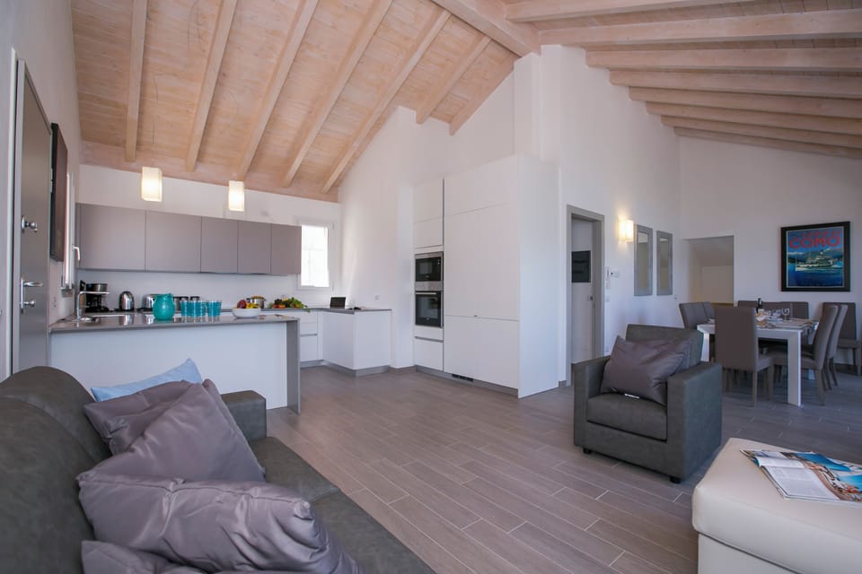 Family Penthouse, Multiple Bedrooms, Mountainside (Paradiso di Menaggio Penthouse) | Living area | Flat-screen TV