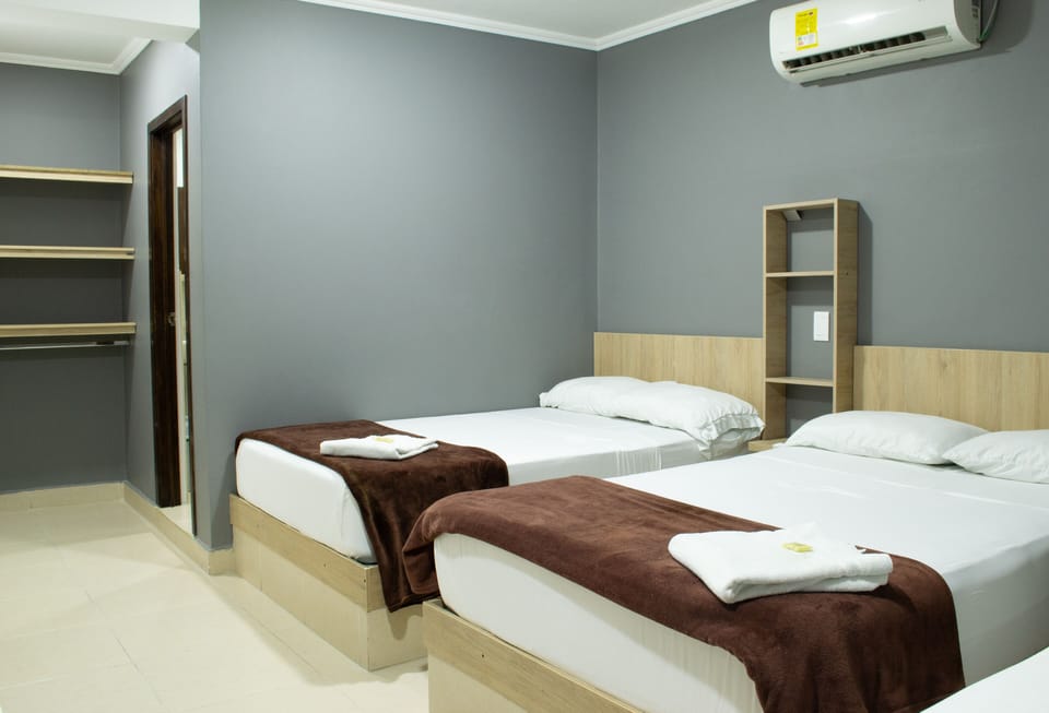 Standard Triple Room | Minibar, desk, laptop workspace, soundproofing