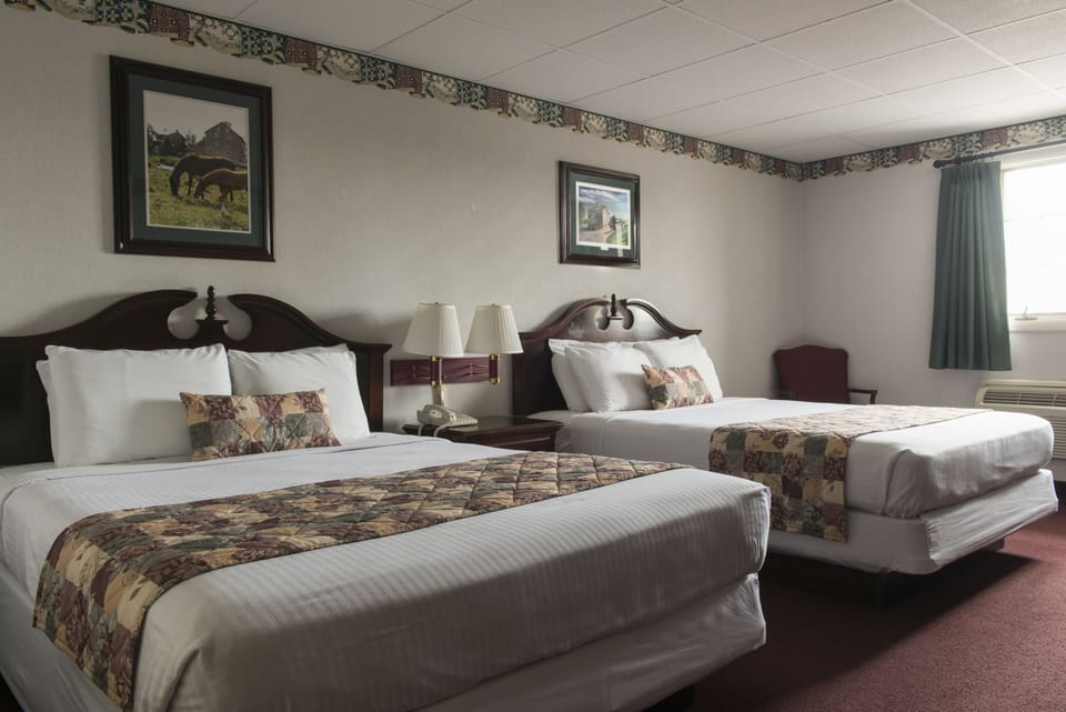 Standard Room, 2 Queen Beds - Pool Building | Desk, blackout drapes, iron/ironing board, cribs/infant beds