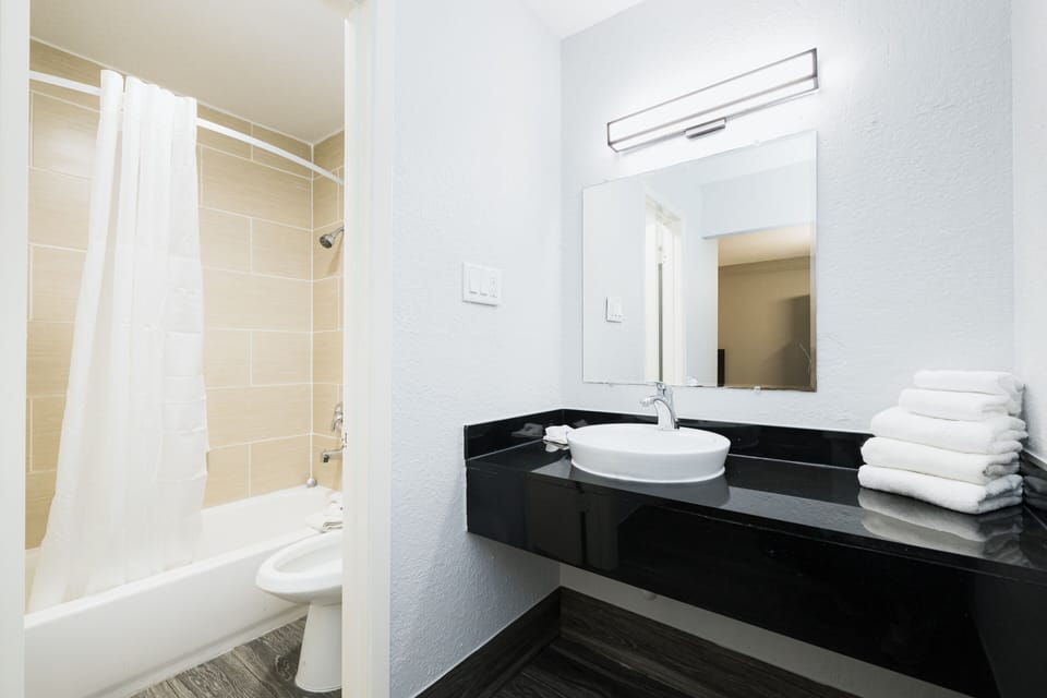 Combined shower/tub, hair dryer, towels, soap