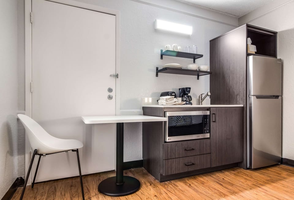 Premium bedding, desk, laptop workspace, blackout drapes