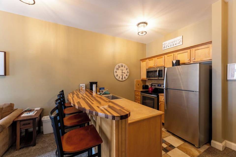 Classic Condo | Private kitchen | Coffee/tea maker, microwave, stovetop, cookware/dishes/utensils
