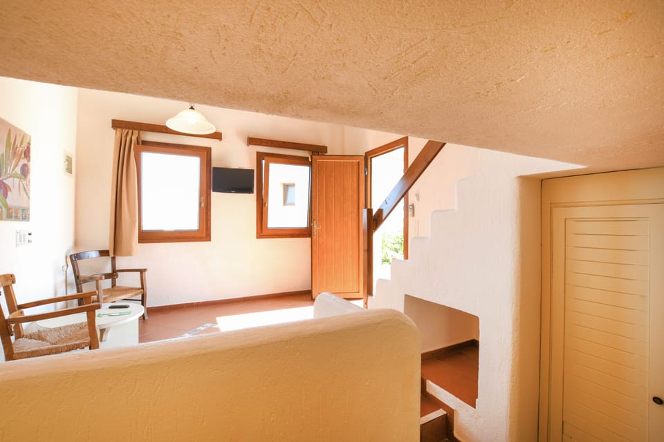 One- Bedroom Maisonette | Living area | Flat-screen TV