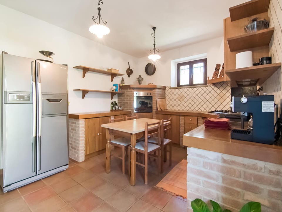 Villa | Private kitchen | Highchair, dining tables