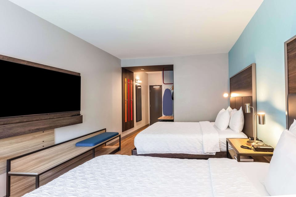 Desk, laptop workspace, blackout drapes, iron/ironing board