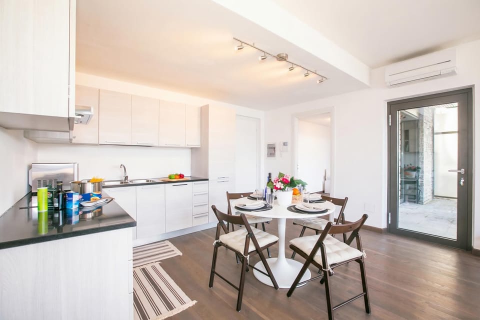 Family Apartment, Multiple Bedrooms, Mountainside (Penthouse-LakeView-AC-PrivateGarden) | Private kitchen | Fridge, microwave, oven, stovetop