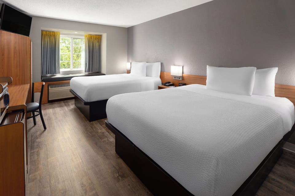 Standard Room, 2 Queen Beds | Desk, iron/ironing board, free cribs/infant beds, free WiFi