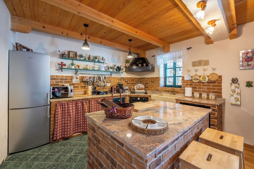 Villa | Private kitchen | Fridge, microwave, oven, stovetop