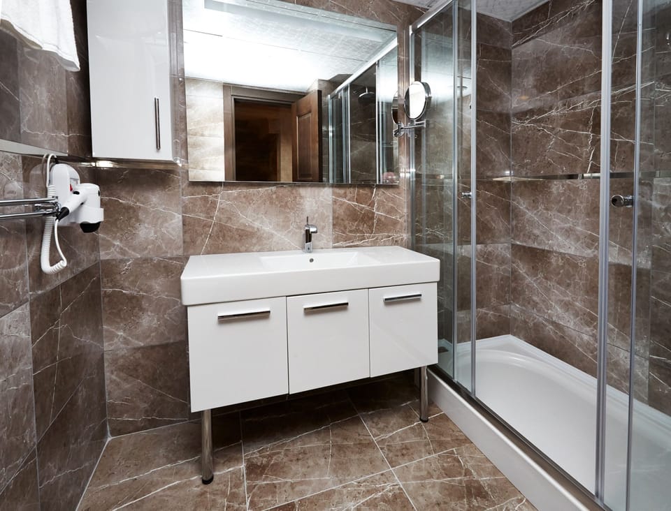 Shower, bathrobes, slippers, towels