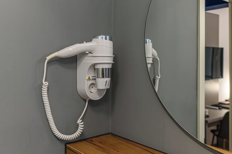 Shower, hair dryer, slippers, towels