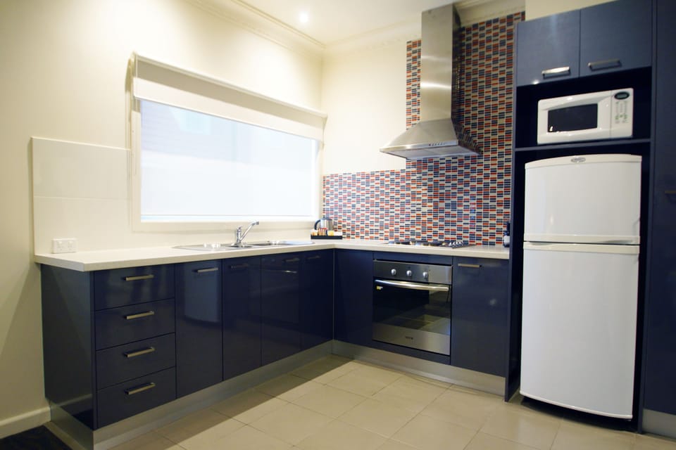 One Bedroom Apartment | Private kitchen | Microwave, coffee/tea maker, electric kettle, toaster