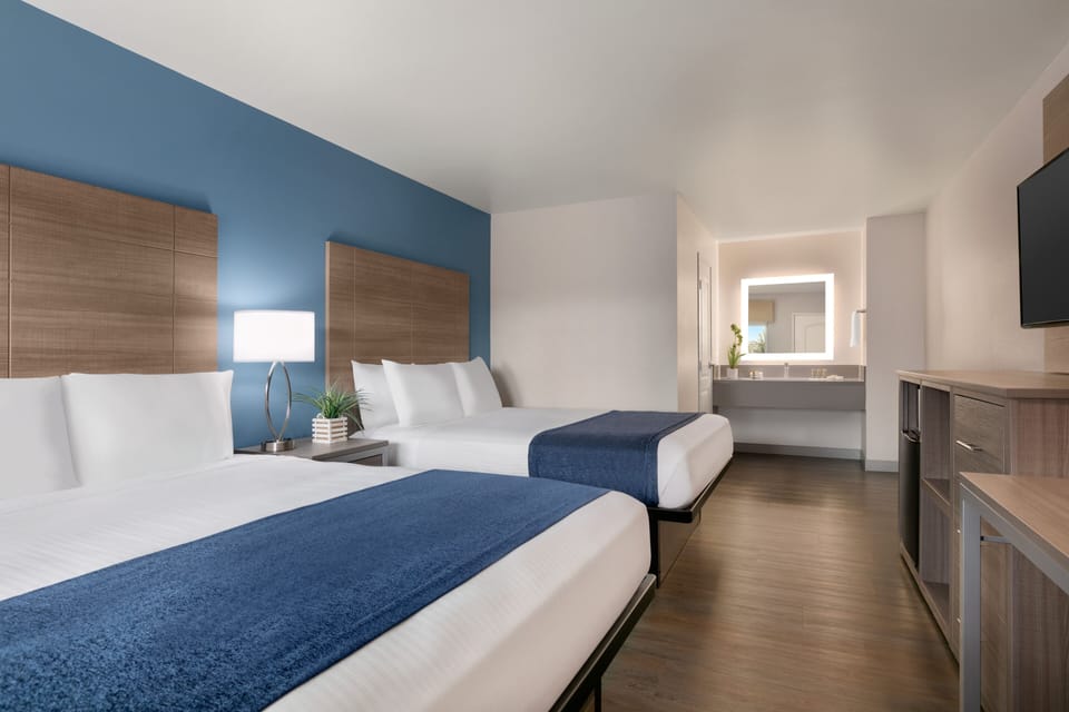 Signature Room | Premium bedding, pillowtop beds, desk, blackout drapes