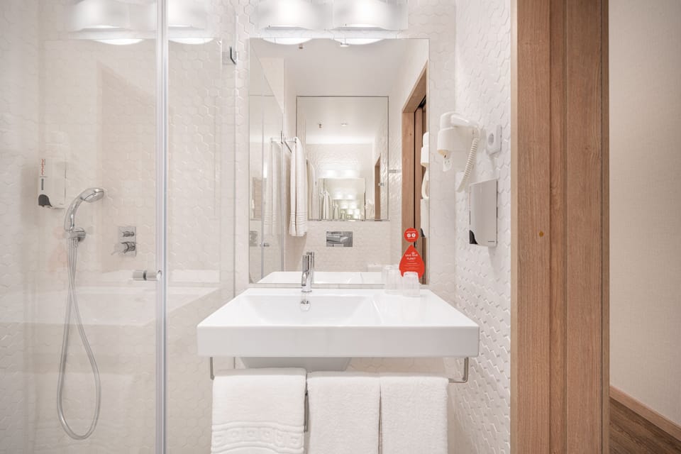 Shower, rainfall showerhead, hair dryer, towels