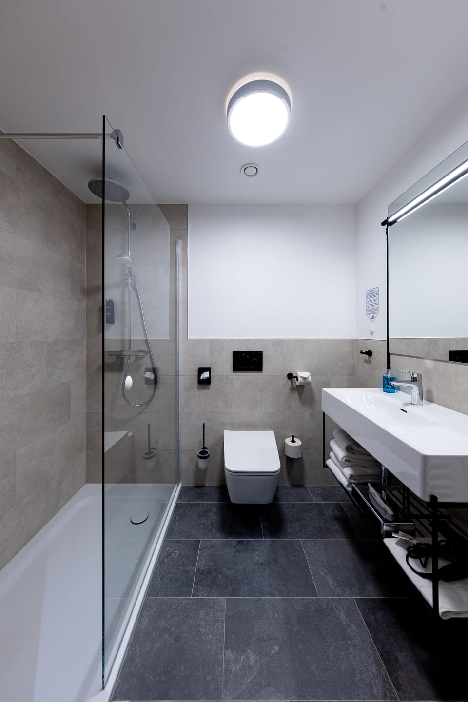 Shower, rainfall showerhead, hair dryer, towels