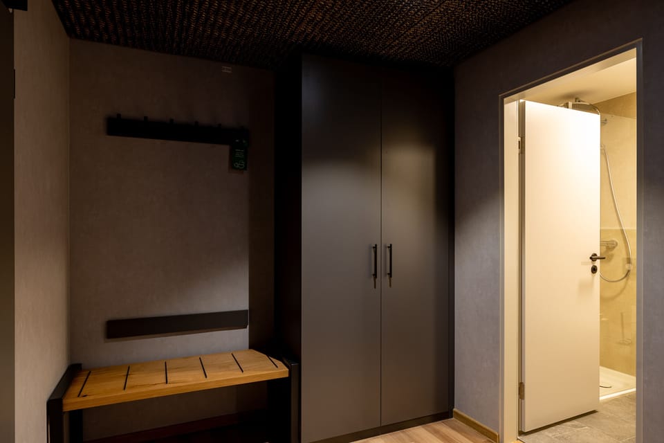 Premium bedding, desk, laptop workspace, blackout drapes