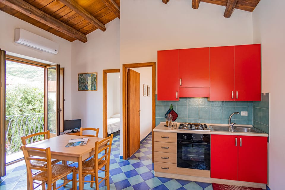 Apartment, 2 Bedrooms | Private kitchen | Full-size fridge, oven, stovetop, cookware/dishes/utensils