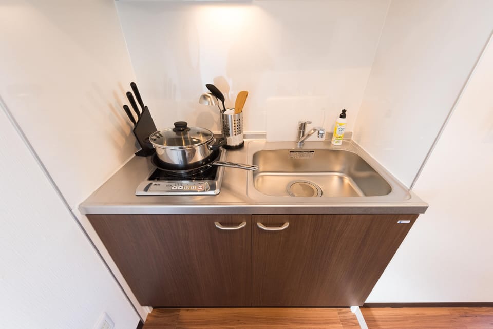 Apartment | Private kitchenette | Fridge, microwave, stovetop, cookware/dishes/utensils
