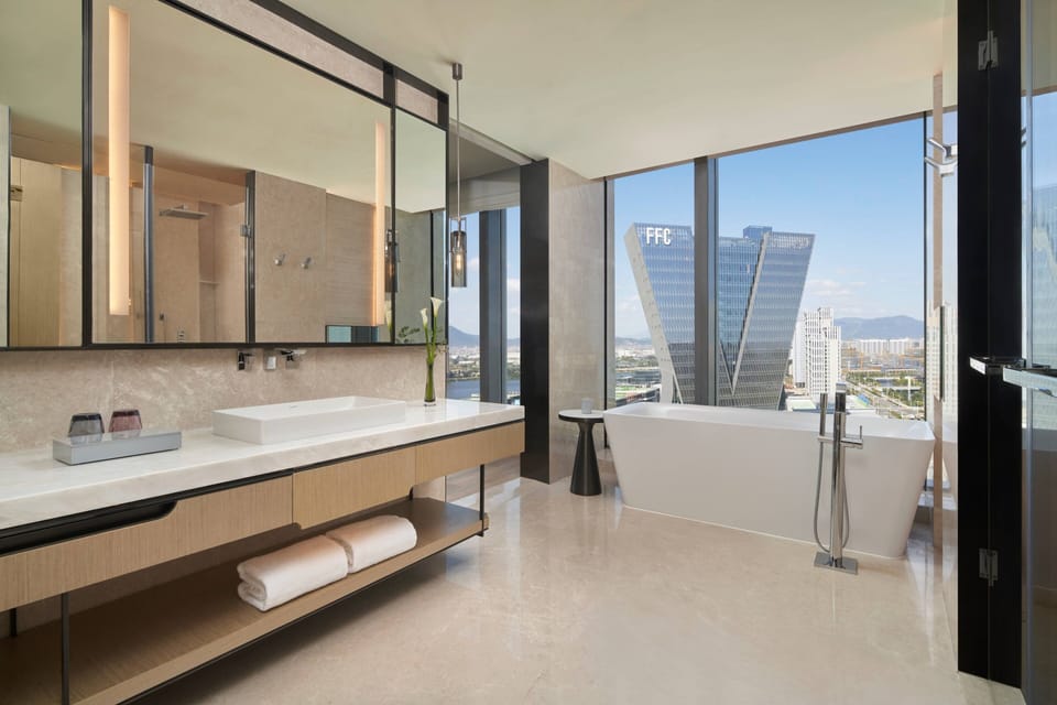 Junior Suite, 1 Bedroom | Bathroom | Separate tub and shower, free toiletries, hair dryer, bathrobes