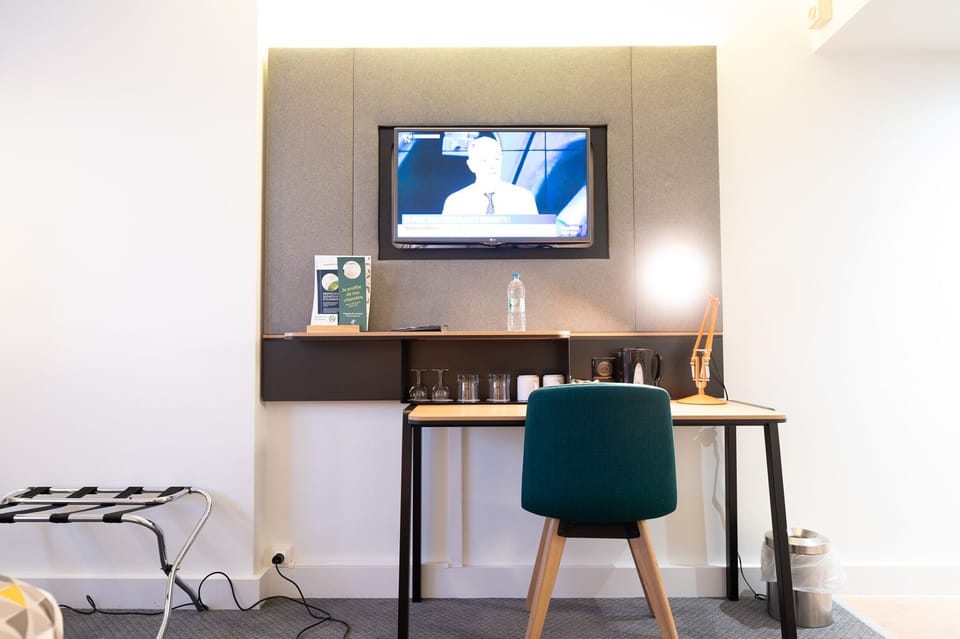 Standard Room, 1 Queen Bed, City View | Minibar, desk, blackout drapes, iron/ironing board