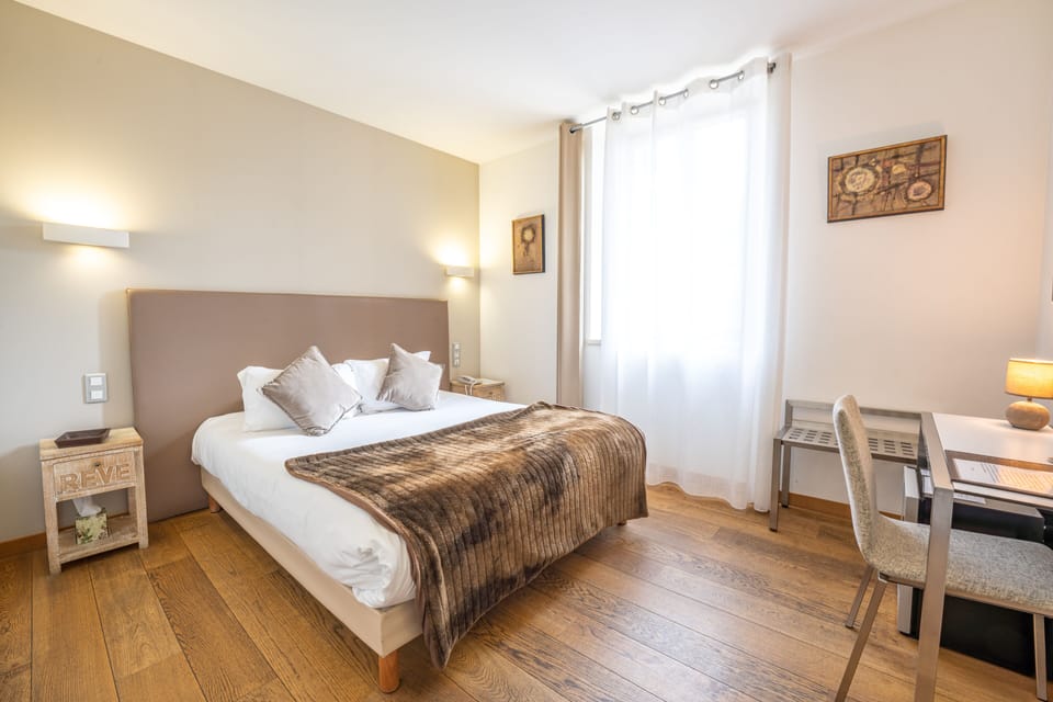 Standard Double Room | Minibar, in-room safe, desk, blackout drapes