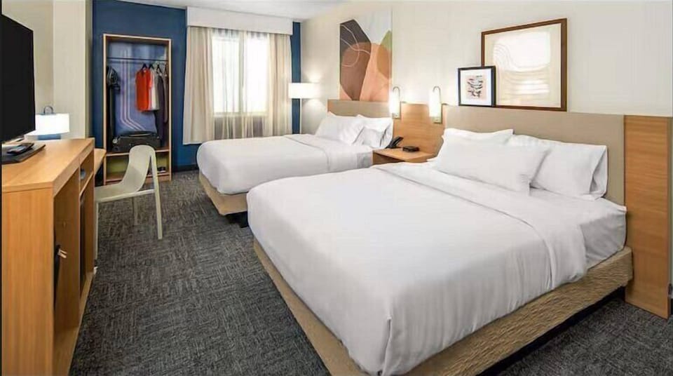 Premium bedding, down comforters, desk, laptop workspace