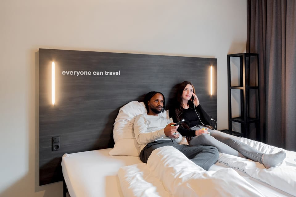 Twin Room | Living area | 24-inch TV with cable channels