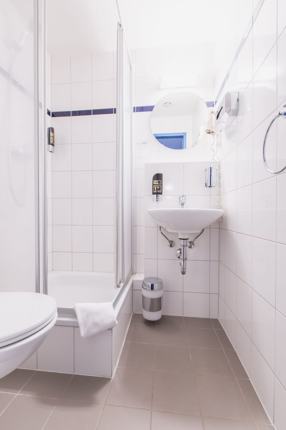 Shower, eco-friendly toiletries, hair dryer, towels