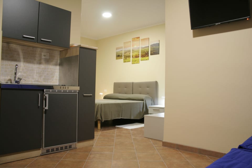 Family Quadruple Room | Down comforters, in-room safe, desk, laptop workspace