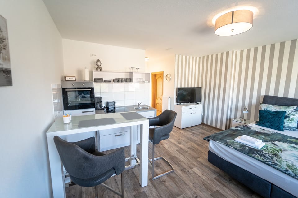 Comfort Apartment | Living area | Flat-screen TV