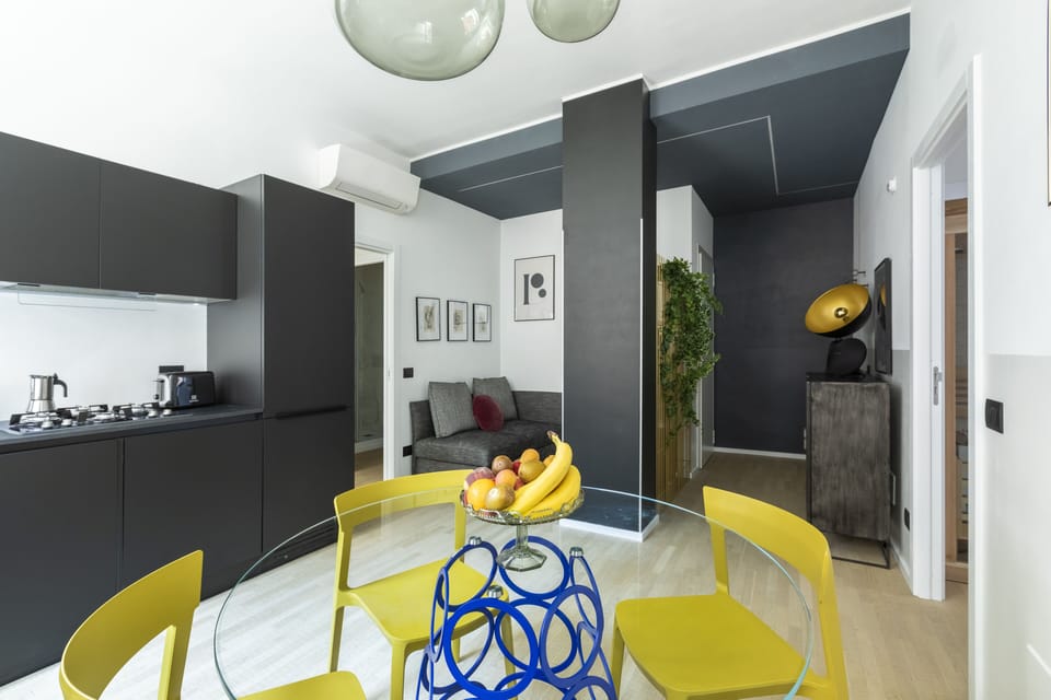 Deluxe Apartment | Living area | 50-inch flat-screen TV with satellite channels, TV, DVD player