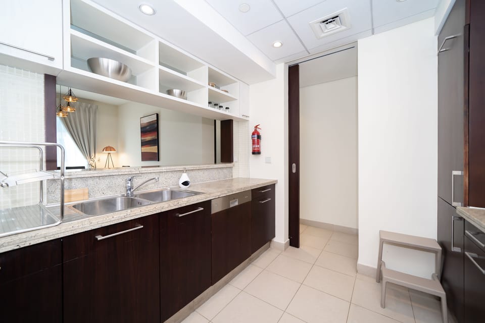 Tower 1 Deluxe Apartment | Private kitchen | Fridge, microwave, oven, dishwasher