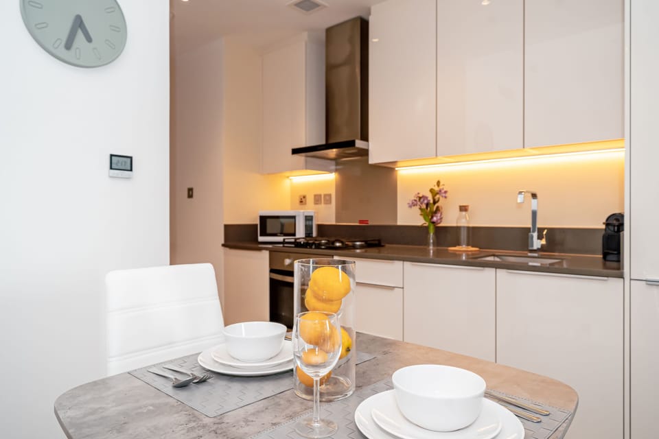 Comfort Apartment | Private kitchen | Electric kettle, highchair, cookware/dishes/utensils, dining tables