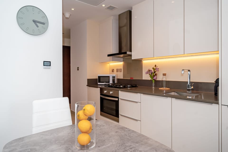 Comfort Apartment | Private kitchen | Electric kettle, highchair, cookware/dishes/utensils, dining tables