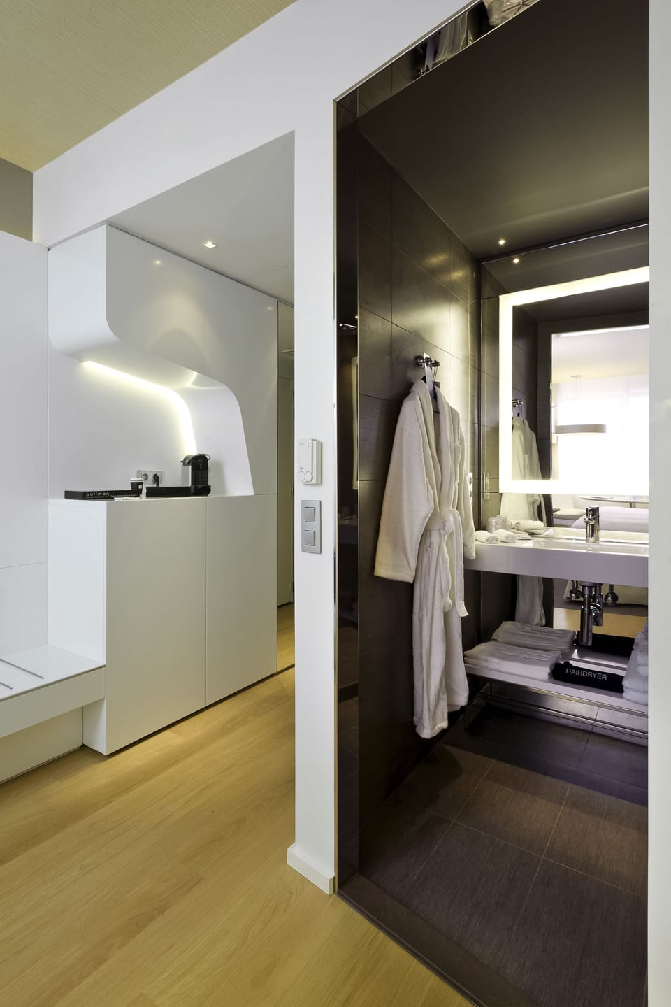 Deep soaking tub, rainfall showerhead, eco-friendly toiletries