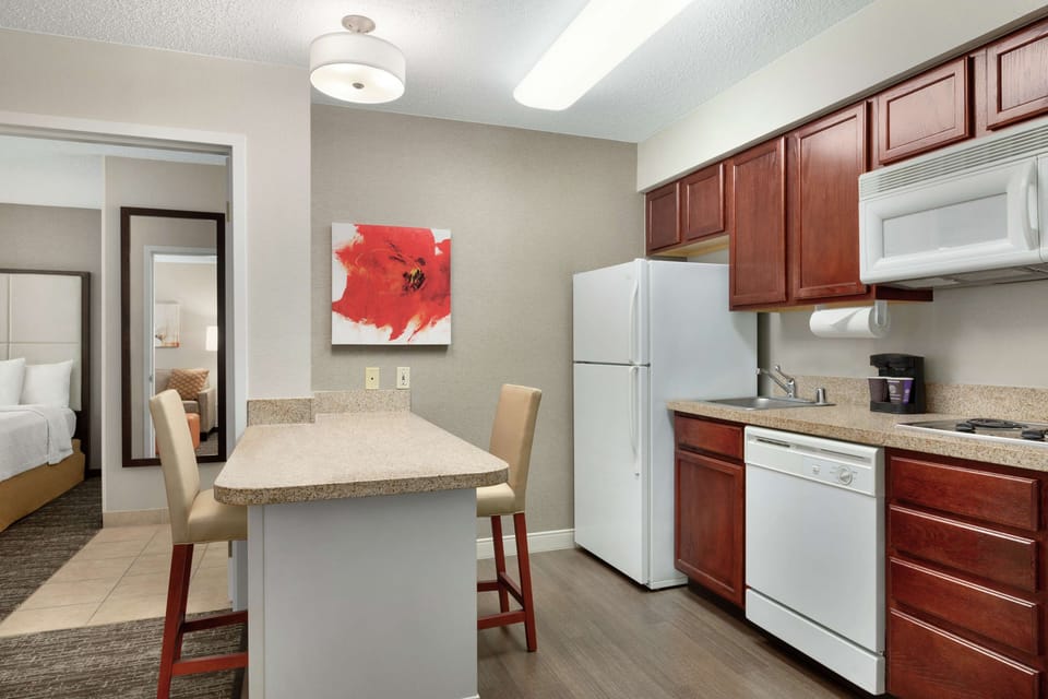 Suite, 1 Bedroom | Private kitchen | Fridge, microwave, stovetop, dishwasher