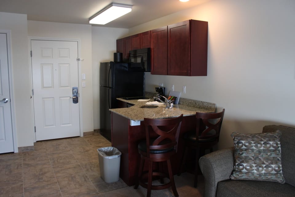 Suite, 1 Bedroom | Private kitchen | Full-size fridge, microwave, stovetop, dishwasher