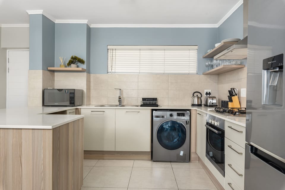 Luxury Apartment | Private kitchen | Full-size fridge, microwave, oven, stovetop