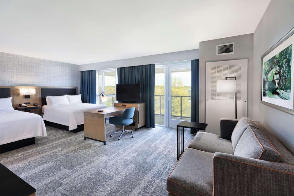 Suite, 2 Queen Beds, Accessible, Balcony | Living area | 42-inch Smart TV with satellite channels, TV