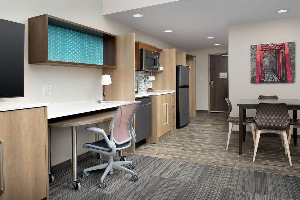Desk, laptop workspace, blackout drapes, iron/ironing board