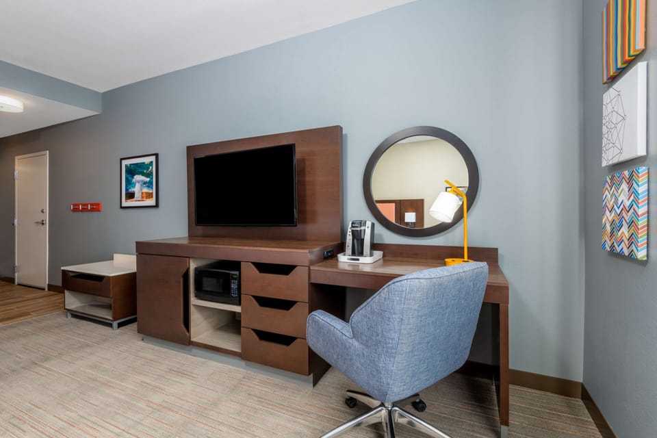 Desk, laptop workspace, blackout drapes, iron/ironing board