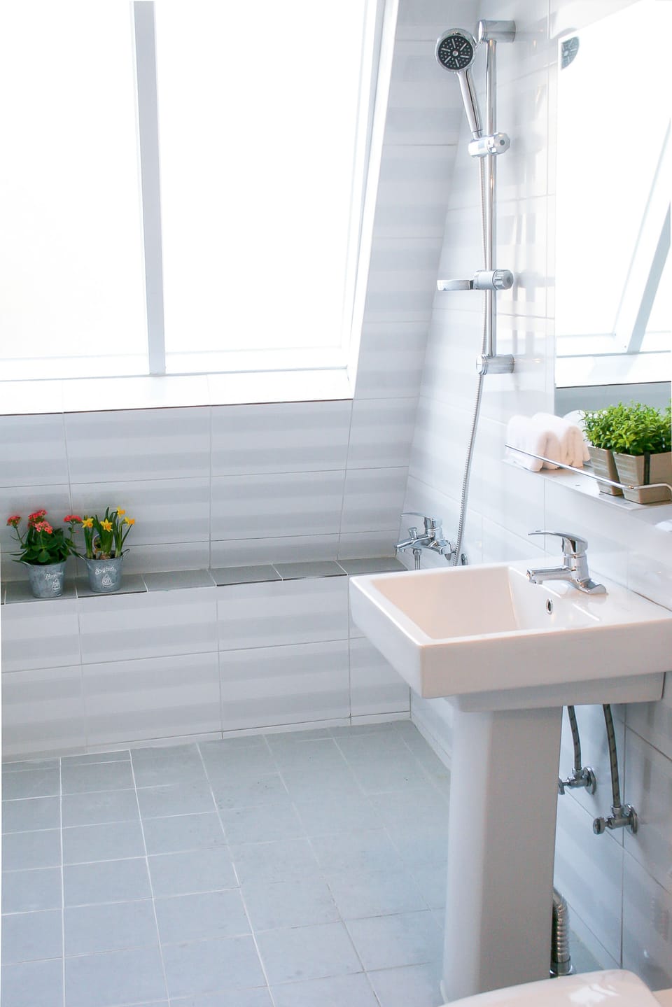 Shower, hair dryer, slippers, towels